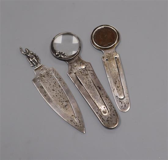 A Sampson Mordan silver man-in-the-moon combination bookmark and magnifying glass and two other silver bookmarks,